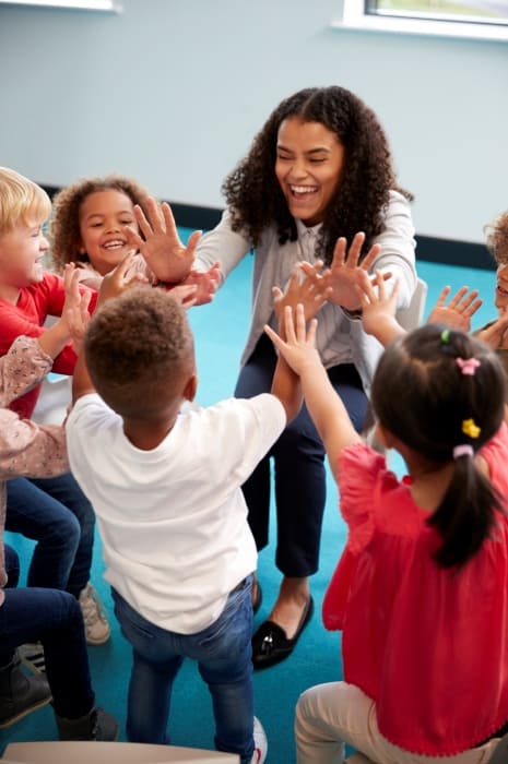 A kindergarten teacher uses her NCIMHA skills to interact with her class.